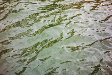 Abstract colorful background from ripples on water surface
