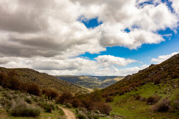 Landscape with far view of mountains on Saint James way, Camino de Levante from Toledo to Avila, Spain
