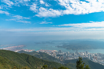 Fototapeta premium Panorama view of Shenzhen cityscape from top of Wutong Mountain on a sunny day