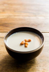 A picture of tofu on a wooden table