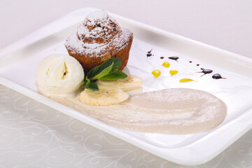 Tasty hot muffin with ice cream