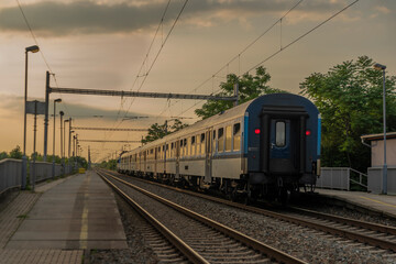 Fototapeta premium Electric blue engine and coaches on fast railway in south of Moravia