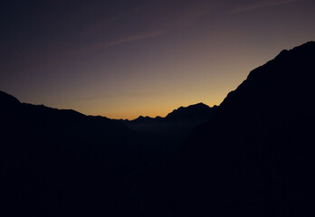 silhouette of mountain range at sunrise