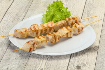 Grilled pork skewer served salad