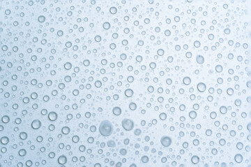 Water drops on a light blue background