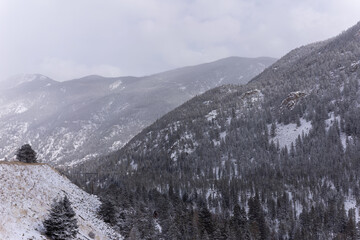 Fototapeta premium Snowy Rocky Mountains outside of Denver Colorado, highway to ski resorts
