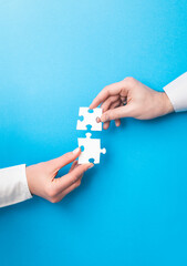 People holds in hand a jigsaw puzzle. Business solutions, success and strategy. - 359231929