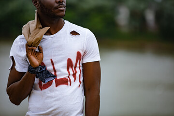 Portrait of man wearing torn protest t shirt