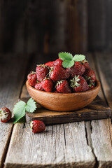 Fresh juicy strawberry on wooden table. Strawberry background