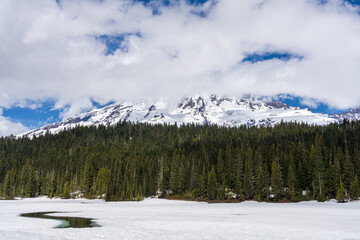 Reflection Lake Thawing Out With Ice and Snow Looking Towards Mount Rainier