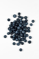 nature and healthy food concept - fresh blueberries isolated on white background