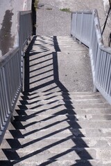The stairs of the overpass with shadows in the morning