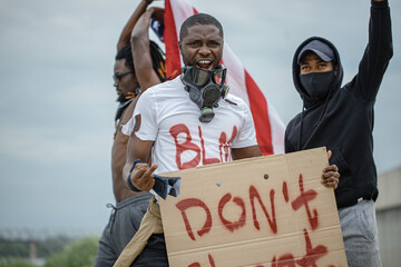 Portrait of three men protesting