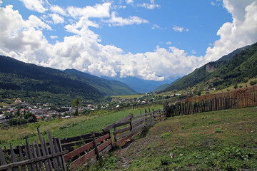 Naklejka premium Green pasture in georgian mountains during summer.