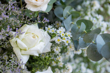    Backdrop of colorful paper roses background in a wedding reception with soft colors.