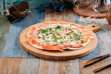 Italian pizza with salted salmon fish and cheese
