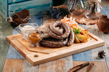 Homemade grilled beef sausage sauerkraut potatoes