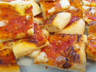 Slices Of Italian pizza Margarita closeup.