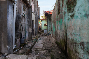Grungy narrow dangerous looking back alley in Latin America.