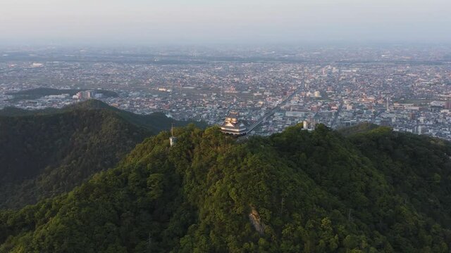 Gifu city and castle aerial pan shot, Japanese sunrise establishing shot