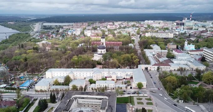 Scenic view from drone of Kaluga cityscape on Oka riverbanks with Holy Trinity Cathedral in cloudy spring day, Russia
