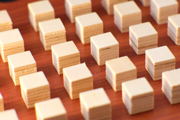 wooden cube block on table background and business concept growth success process and plan growth and increase of positive indicators in his business