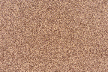 Fototapeta na wymiar Light brown background with dark brown speckles