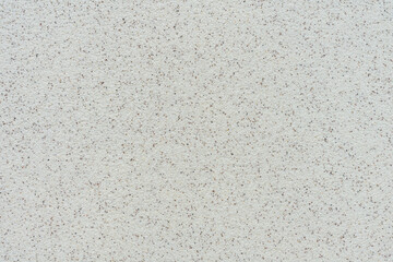 Light background with black dots. Modern decoration of the house. Plaster