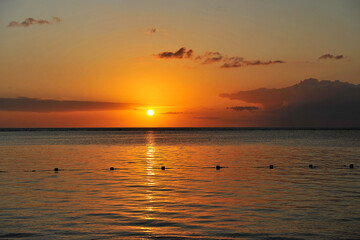 Beautiful sunset on ocean cost of tropical island.