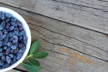 Honeysuckle berries in a vase on the table, honeysuckle, healthy berry, proper nutrition, jam,...