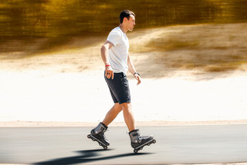 Aggressive inline skating. Young sporty man is rollerblading