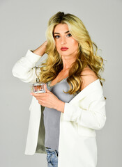 Femininity. Attractive woman hold perfume bottle. Favorite fragrance. Fragrance for youth. Female fragrance concept. Perfume created for daring person. Girl long curly hair satisfied with aroma