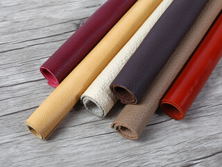 Rolled up multicolored natural leather textures samples