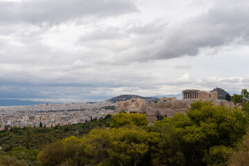 Fototapeta na wymiar Acropolis seen from far away in autumn. Drone bird eye view style. Athens Greece most popular tourist place