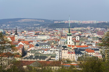 Fototapeta na wymiar Aerial view of Brno with Church of St. James and Lisen panel housing estate in background, Moravia, Czech Republic, sunny day