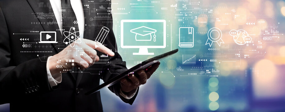 E-learning concept with businessman using his tablet computer