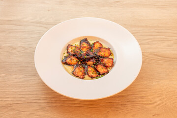 Grilled octopus dish