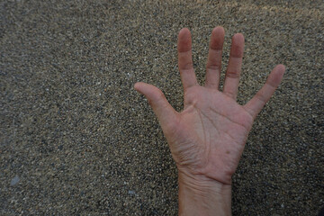 Our hands on the brown cement floor