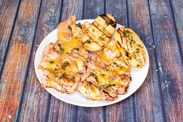 Grilled chicken meat with roasted potatoes