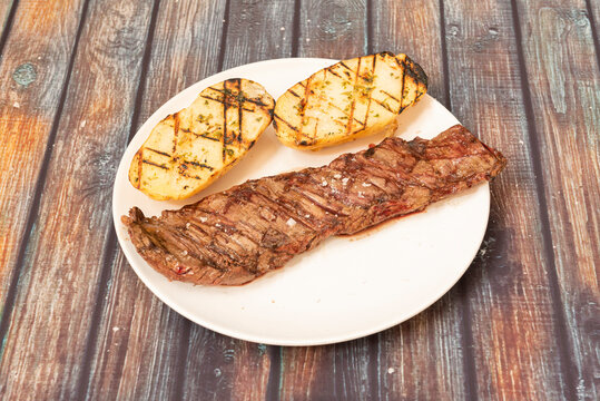 Beef entrails with grilled potatoes