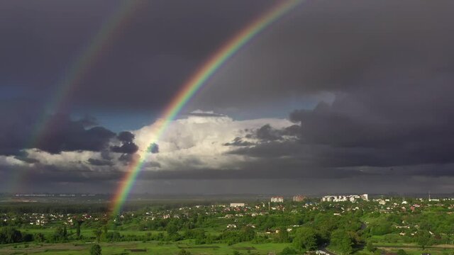 aerial drone flight near double rainbow, 4k