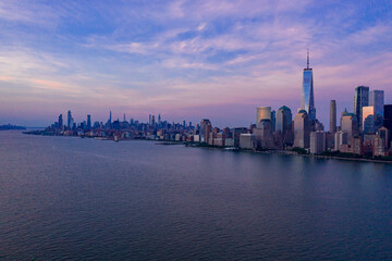 Fototapeta na wymiar Aerial view of low Manhattan, new york at beautiful cloudy dusk from Hudson river