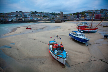 fishing boats stranded on the beach at low tide (harbor of St. Ives, Cornwal)