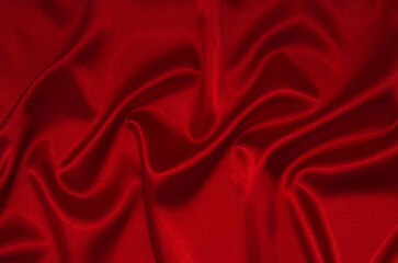 Obraz na płótnie Canvas red satin or silk fabric as background