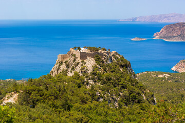 Obraz premium The castle of Monolithos located at the summit of the tall rock. Rhodes island, Greece