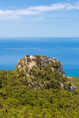 Fototapeta na wymiar The castle of Monolithos located at the summit of the tall rock. Rhodes island, Greece
