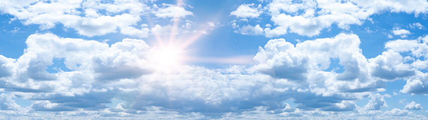 Hot cloudy summer background banner panorama - Blue sky with clouds and glowing sun