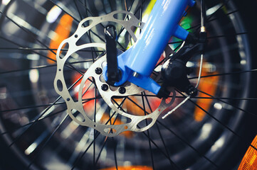 Obraz premium Mountain bike wheel with disc brake close up.