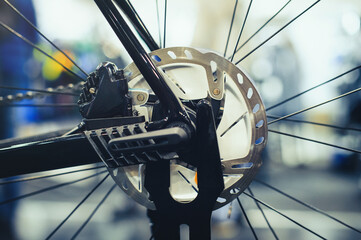 Obraz premium Mountain bike wheel with disc brake close up.