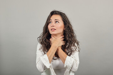 Hands around throat, screaming, panicking in trouble as chokes on food stuck and is making the...